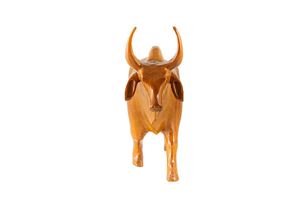 istock wood cow on white background 516617371