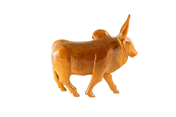 istock wood cow on white background 516617375