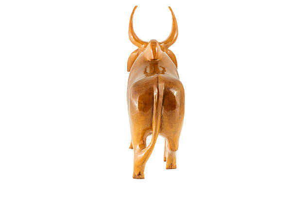 istock wood cow on white background 516617377