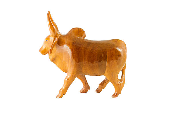 istock wood cow on white background 516617381