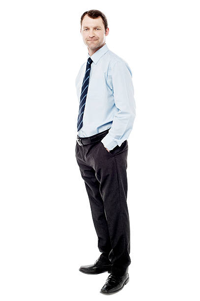 istock Confident businessman with hands in pockets 516618147