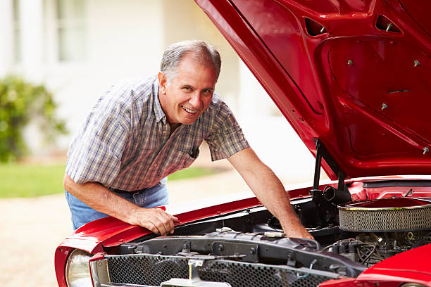 istock Retired Senior Man Working On Restored Car 516618341