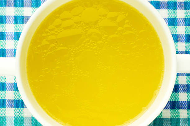 Fat oily broth, bouillon, clear soup Fat oily broth, bouillon, clear soup close-up stock cubes stock pictures, royalty-free photos & images