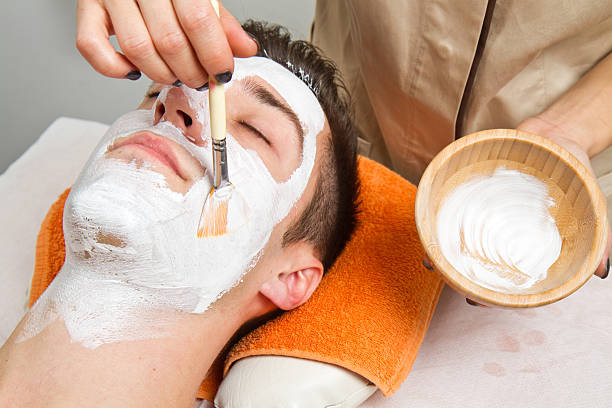istock Therapist applying a face mask to  beautiful young man 516621181