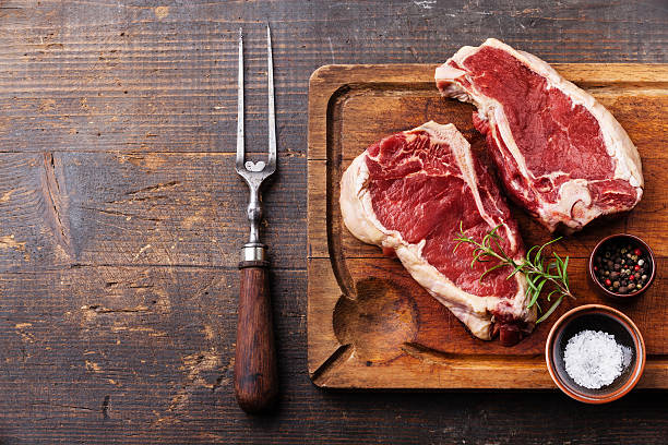 istock Raw meat Steak, seasoning and meat fork 516621423
