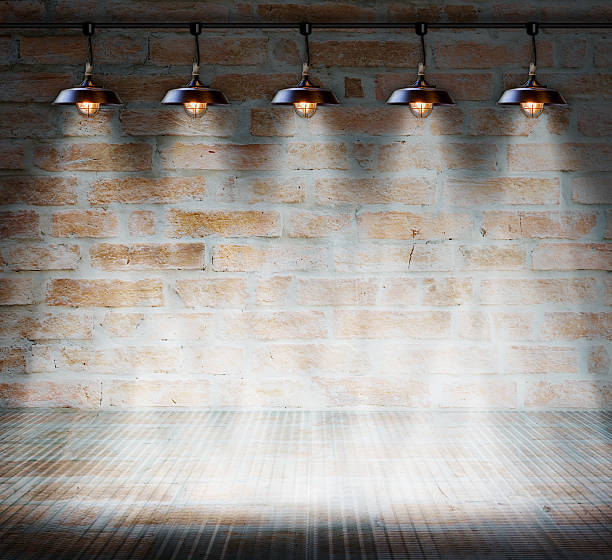 istock Lamp at brick wall background with glass floor 516621737