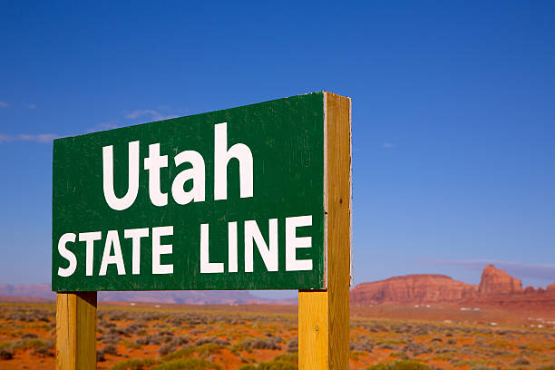 istock Road sign between Utah and Arizona State Line 516622047