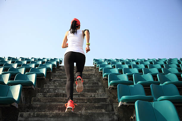 istock Runner athlete running on stairs. 516622216