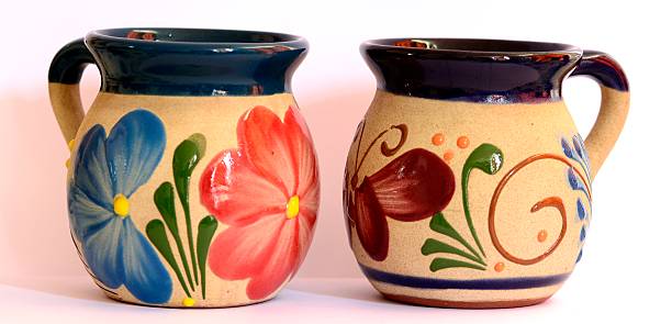 Mexican pottery, two traditional cups, flower and butterfly