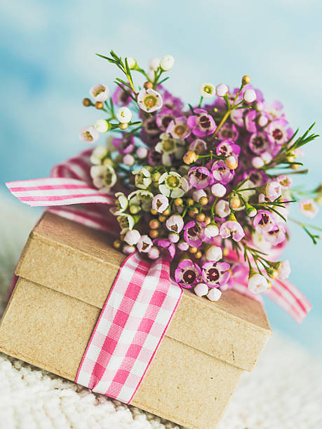 istock Mother's Day gift with beautiful flower bouquet 516628748