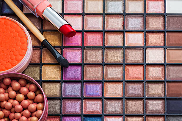 istock Colorful makeup brushes and makeup eye shadows 516630084
