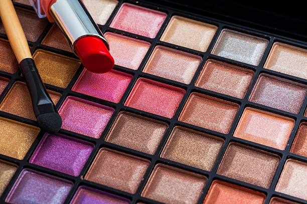 istock Colorful makeup brushes and makeup eye shadows 516630212