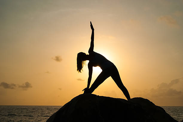 istock The woman practices yoga at dawn 516632136