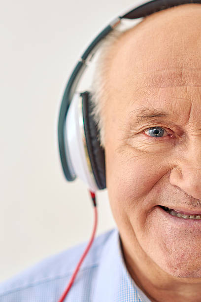 istock Grandpa listens to music 516632236