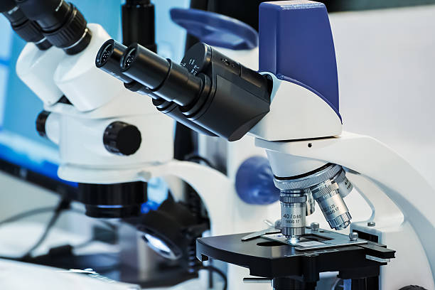 istock Laboratory Microscope. Scientific and healthcare research background 516632551