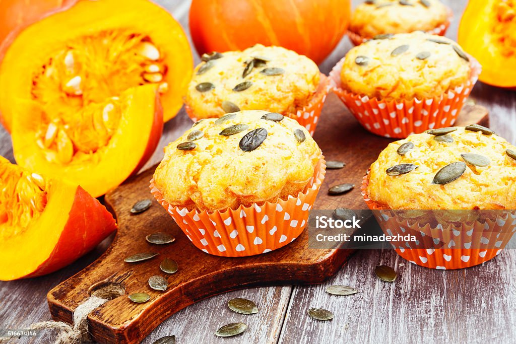 Homemade pumpkin muffins Homemade pumpkin muffins on the wooden table Baked Stock Photo