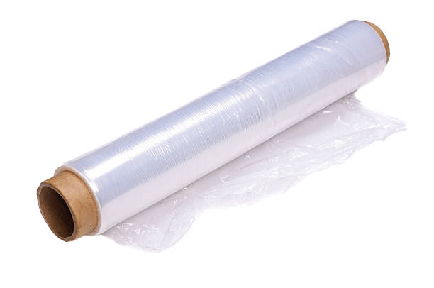 Wrapping plastic stretch film Roll of wrapping plastic stretch film. Close-up with selective focus and Shallow Depth of Field. Isolated on white background. polythene photos stock pictures, royalty-free photos & images
