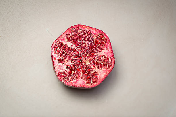 Half a Pomegranate on a grey background