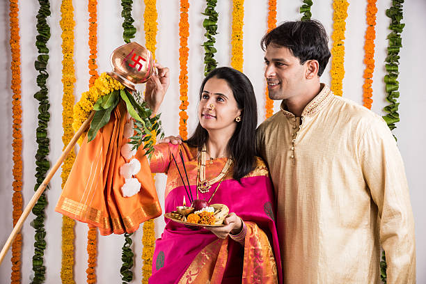 istock smart indian couple performing gudhi padwa puja 516635080