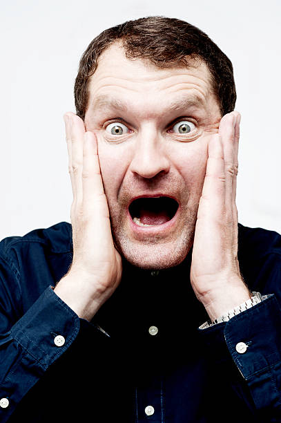 istock Man with shocked facial expression 516635553