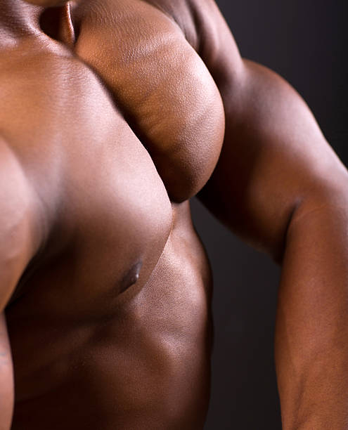 istock african muscular man body closeup 516636295