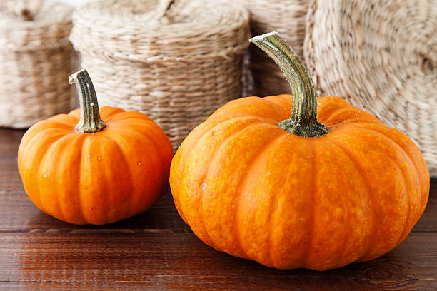 istock Fresh pumpkins on a wooden table 516636539