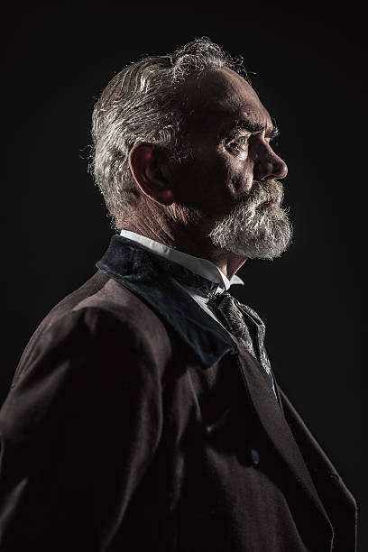 Vintage characteristic senior man with gray hair and beard.