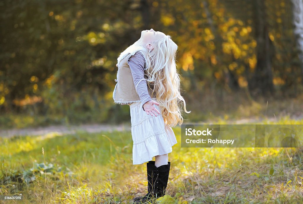 Joyful blond teen girl Joyful blond teen girl in sunny day Autumn Stock Photo