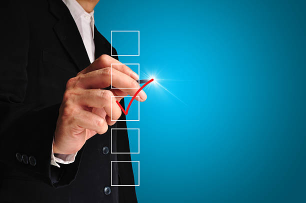 istock Young business man drawing a tick 516639565