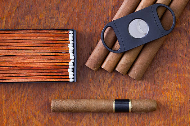 istock Different cigars on the decorative wooden desk 516645604