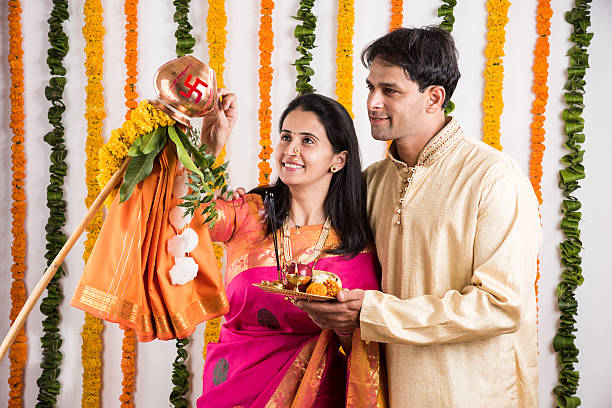 smart indian couple performing gudhi padwa puja