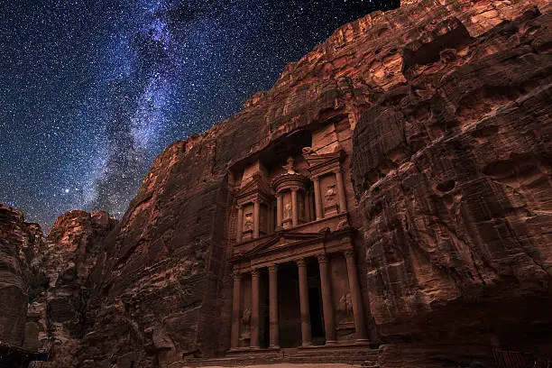 Ancient Petra on the background of the night starry sky. Jordan.