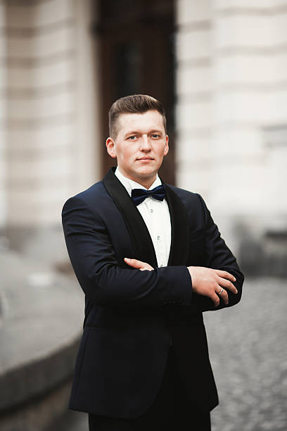 istock Sexy man, groom posing in old city 516647468