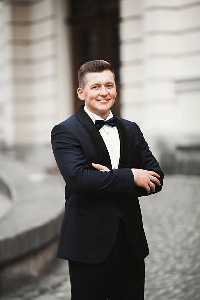 istock Sexy man, groom posing in old city 516647574