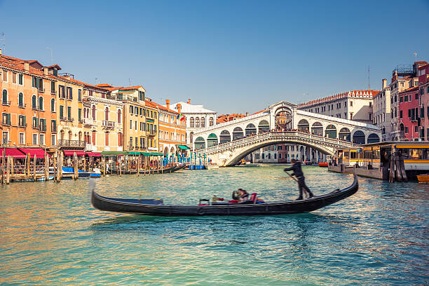 Rialto Bridge in Venice Gondola near Rialto Bridge in Venice, Italy venice italy stock pictures, royalty-free photos & images