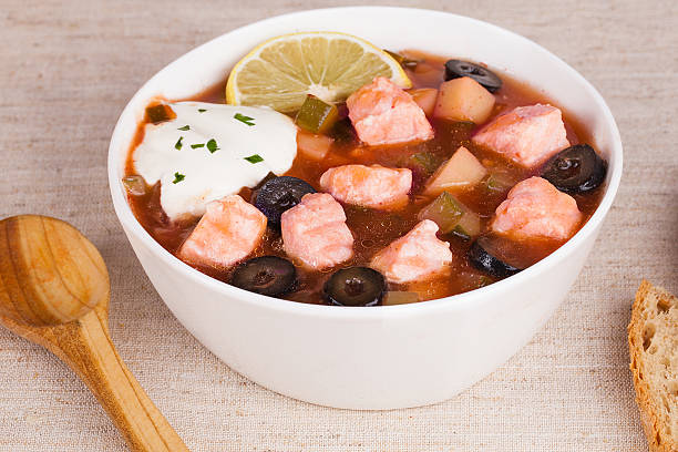 Fish thistle soup with meat sour cream and lemon in stock photo