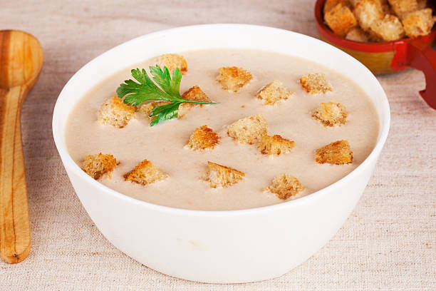 istock cream soup with croutons in a still life Russian style 516650620