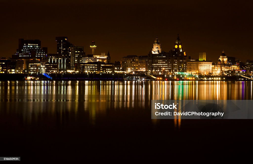 Liverpool Cityscape A time exposure of Liverpools iconic World Heritage waterfront on a still flat calm evening on the River Mersey Urban Skyline Stock Photo