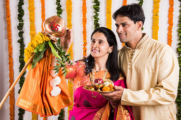 istock smart indian couple performing gudhi padwa puja 516651634