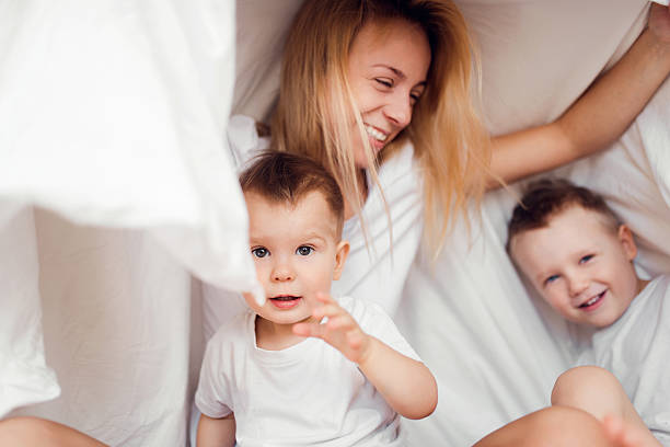 istock Happy famili in bed 516651916