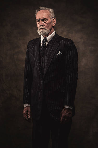 istock Characteristic senior business man with gray hair and beard. 516652943