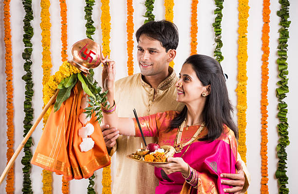 istock smart indian couple performing gudhi padwa puja 516653032