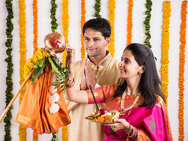 istock smart indian couple performing gudhi padwa puja 516654716