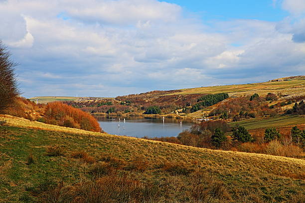 Sailing Boats on Scammonden Water, West Yorkshire, England Pretty scene of boats sailing on Scammonden Water, with fluffy couds and rolling hills, West Yorkshire, England. pennines photos stock pictures, royalty-free photos & images
