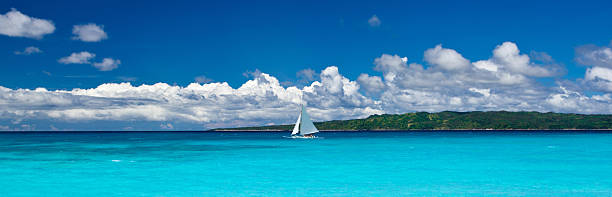 istock Beach with sailboat in ocean 516655397