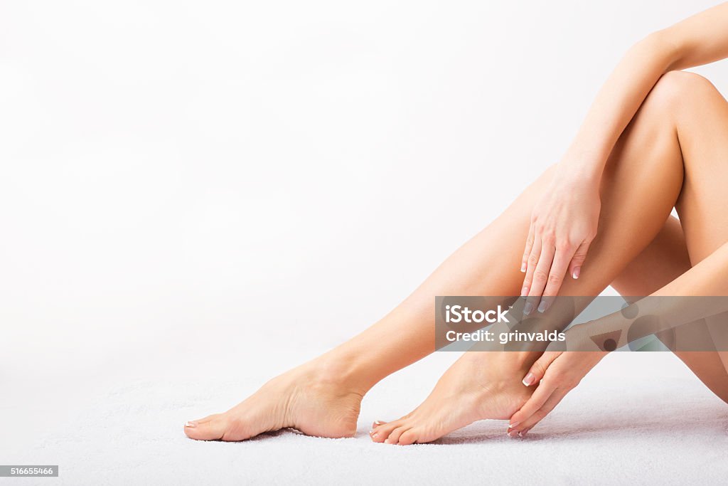 Female taking care of her feet Women Stock Photo
