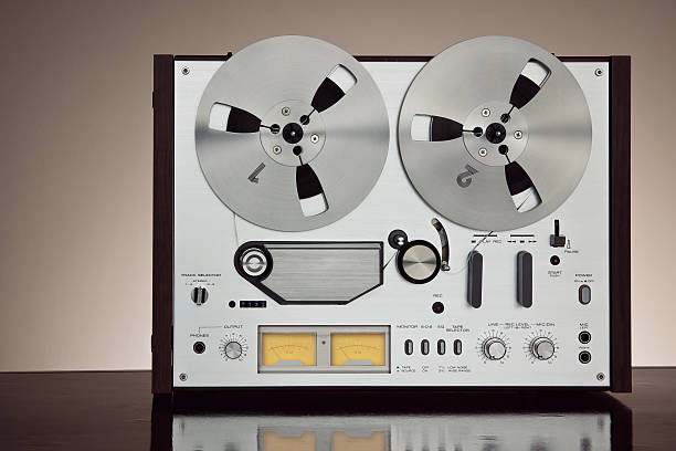 istock Analog Stereo Open Reel Tape Deck Recorder Vintage Closeup 516656055