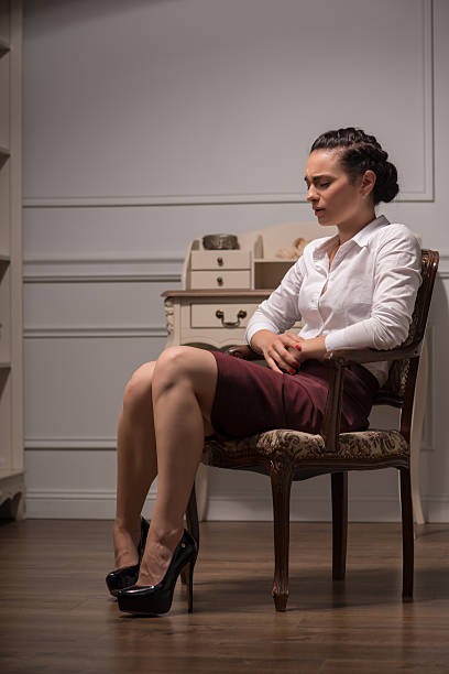 istock Serious woman wearing white blouse 516656099
