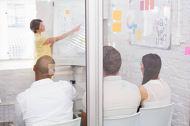 istock Business team sitting while listening to a colleague 516656607