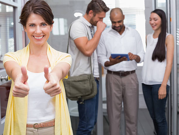 istock Woman giving thumbs up at camera 516657269